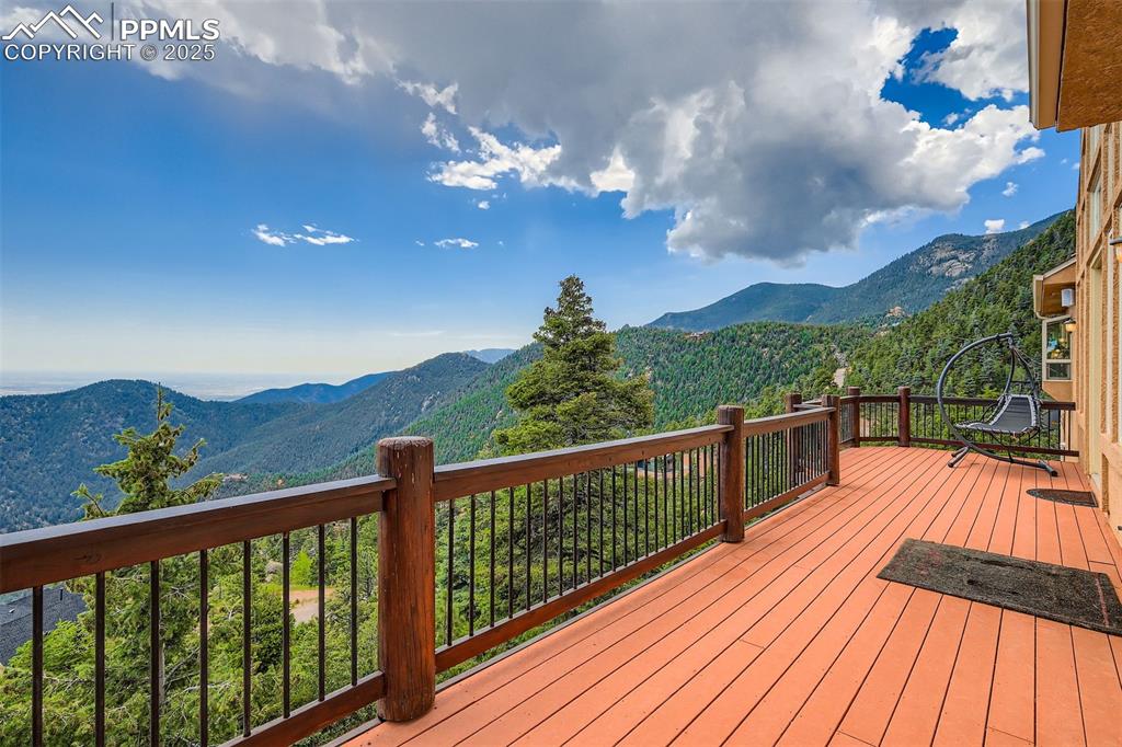 Image 34 of 35: Expansive deck featuring a mountain view to the Plains and Colorado Springs