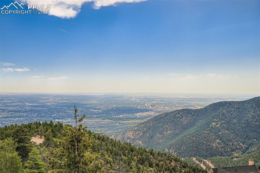 Image 35 of 35: View of mountains, valleys and Colorado Springs from deck