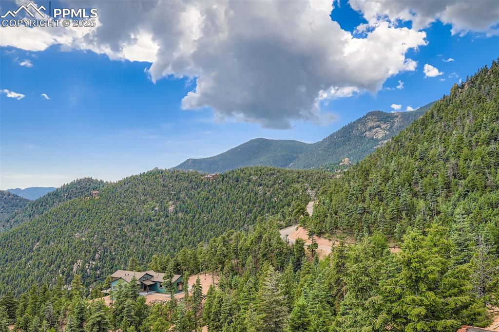 Image 4 of 27: Extensive view of mountains from entry and deck