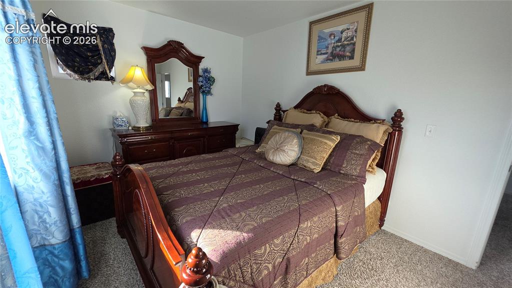 Image 21 of 48: White walls and neutral carpet flooring