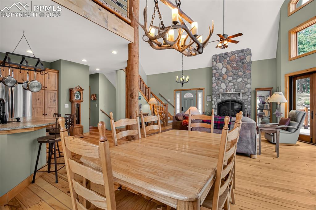 Image 11 of 48: Open concept great room with vaulted ceilings, a walk out to wrap around de