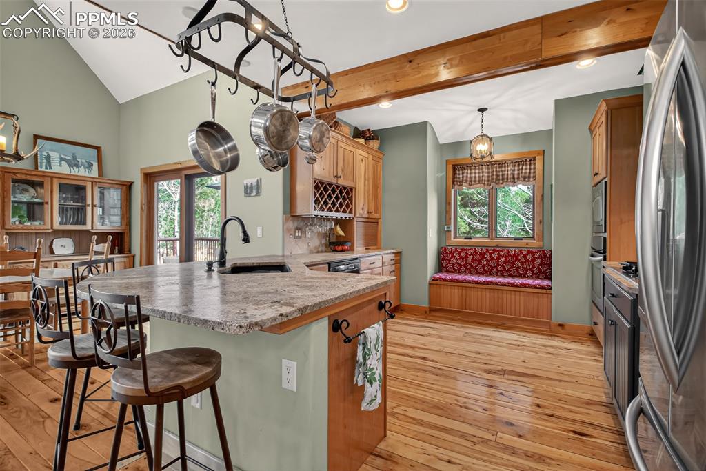 Image 13 of 48: Wrap around deck off great room