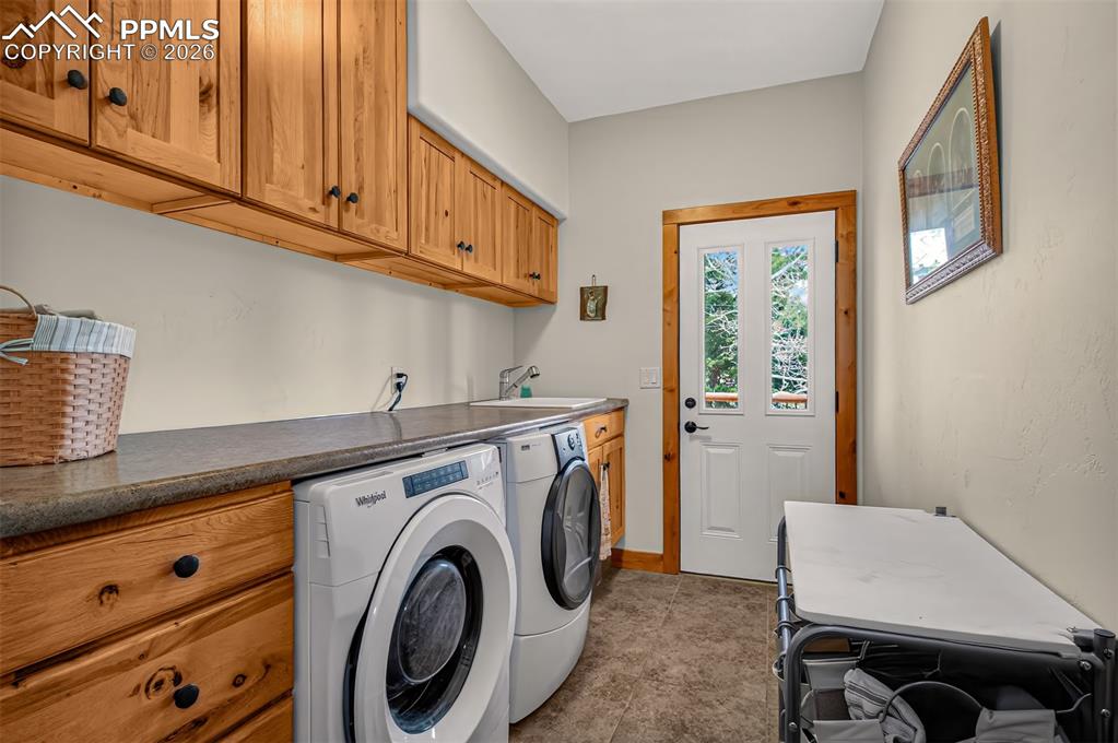 Image 18 of 48: Open concept kitchen with leathered granite countertops, pullout pantry she