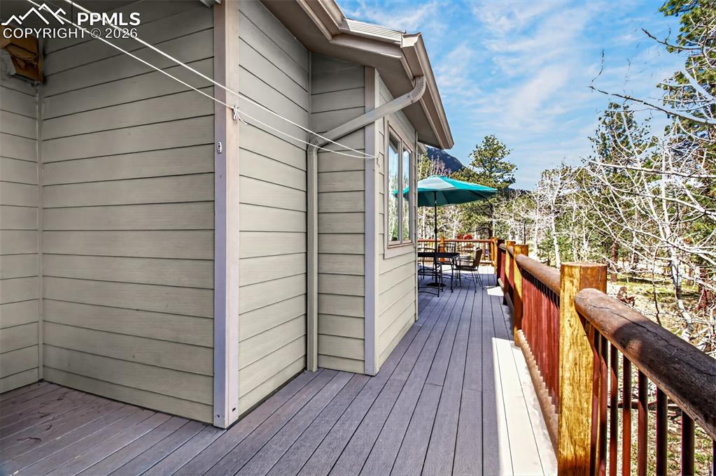 Image 19 of 48: Open concept kitchen with leathered granite countertops, pullout pantry she