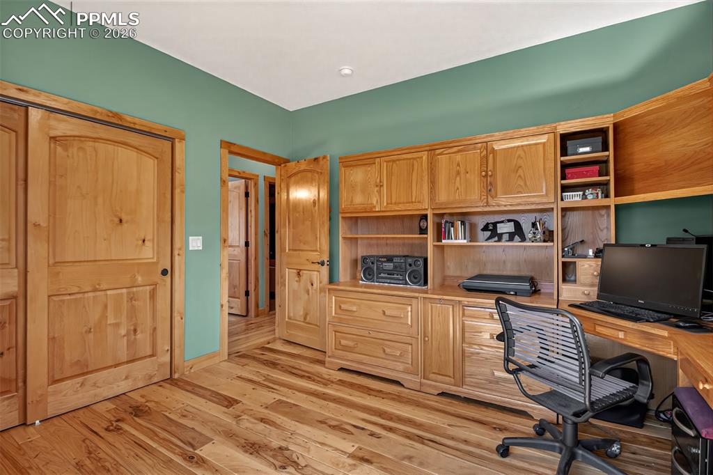 Image 20 of 48: Open concept kitchen with leathered granite countertops, pullout pantry she
