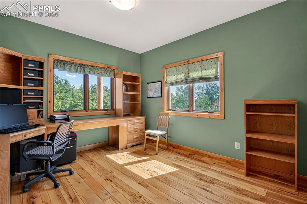 Image 21 of 48: Full bathroom on the main level with a granite countertop with copper sink 