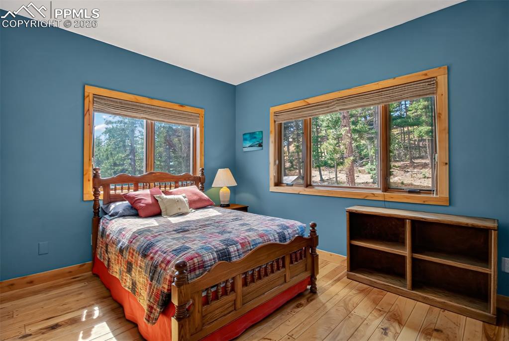 Image 22 of 48: Main level laundry room with access to the wrap around deck and a utility s