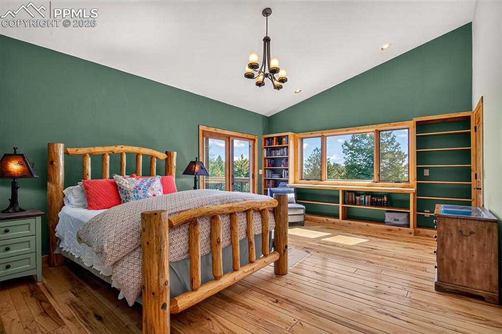 Image 24 of 48: Bedroom 2 on the main level being used as an office space. Just look at tho