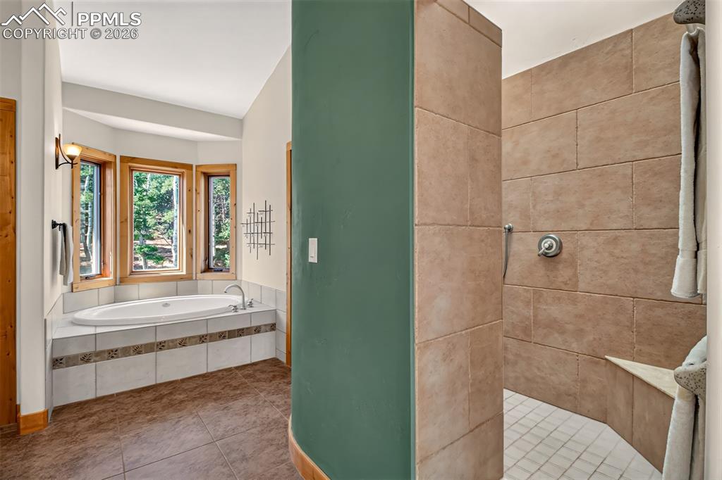 Image 30 of 48: Walk out to trex deck from primary bedroom 