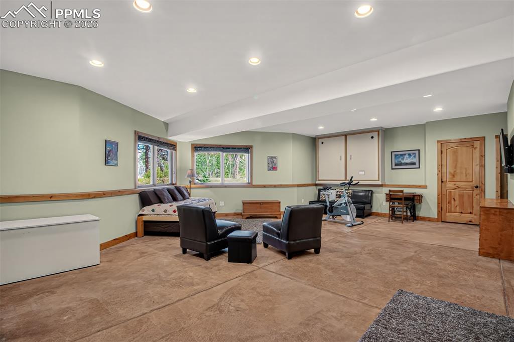 Image 34 of 48: 5 peice en suite primary bathroom with dual copper sinks surrounded by gran