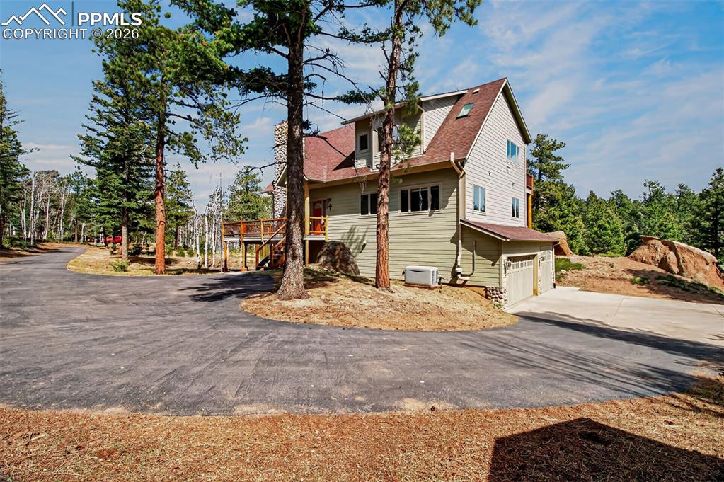 Image 41 of 48: Recreation room on the lower level with a murphy bed, 3/4 bathroom, a pelle