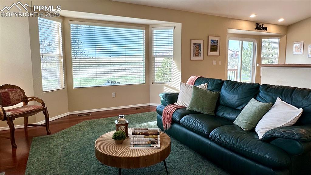 Image 5 of 42: 4 bay windows fill rooms with natural light