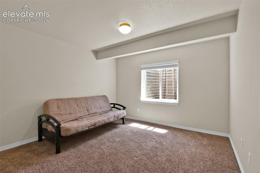 Image 27 of 32: Basement bedroom