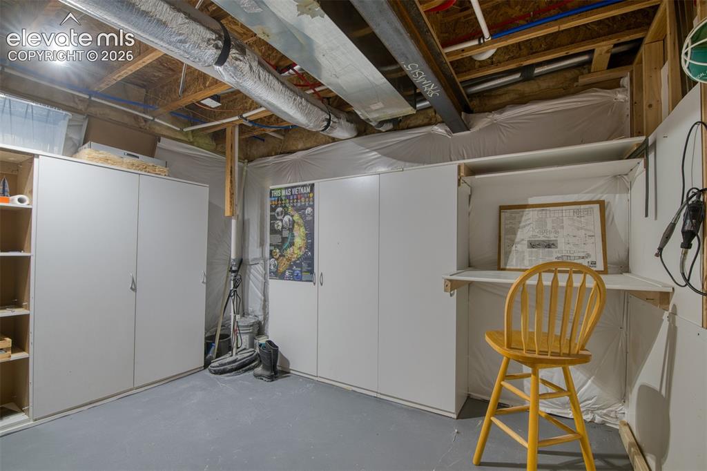 Image 28 of 32: Utility Room with work space 