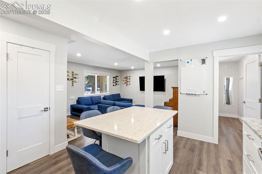 Image 12 of 31: Looking into the laundry room with half bath.