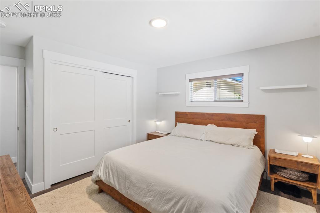 Image 14 of 31: Bedroom featuring a closet and wood finished floors