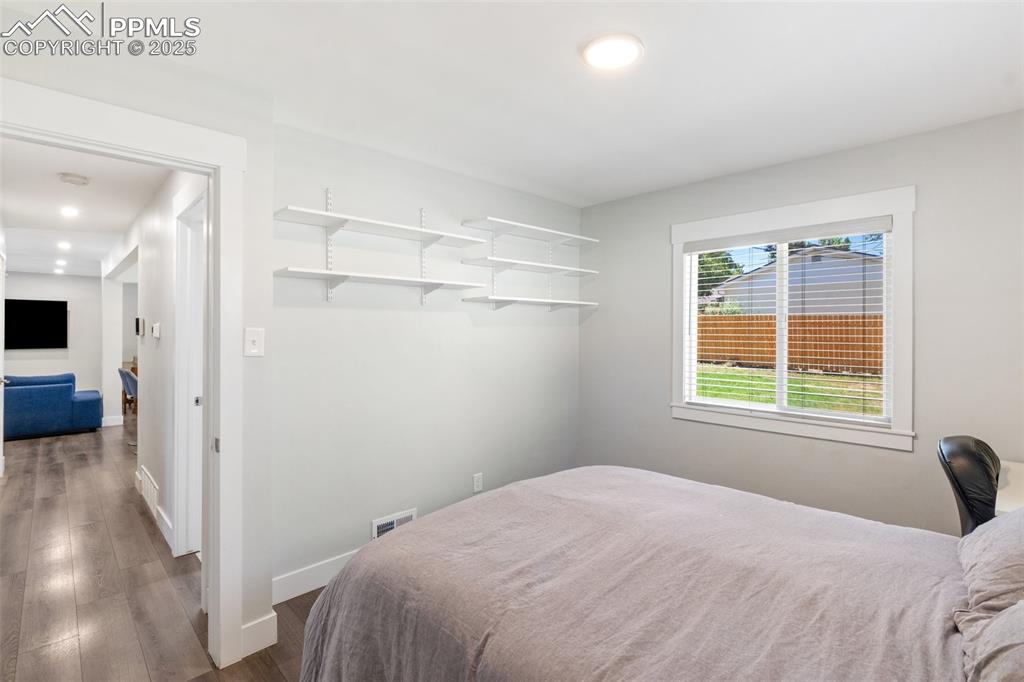 Image 22 of 31: Bedroom featuring dark wood-type flooring and recessed lighting