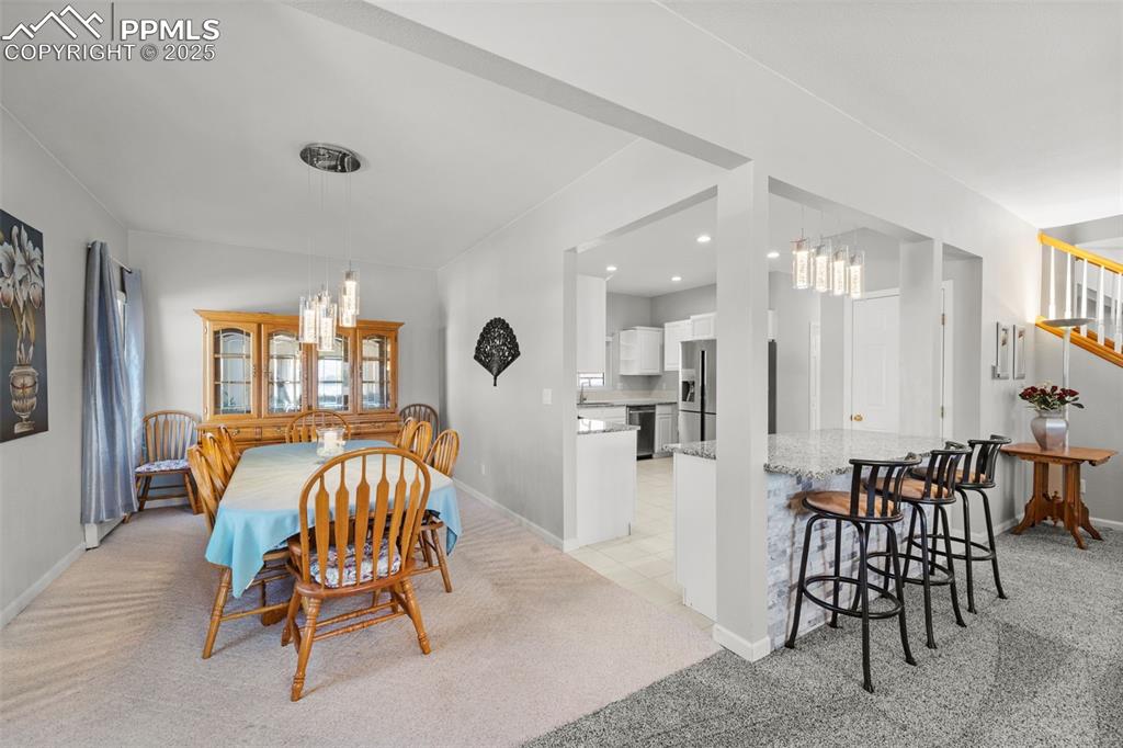 Image 13 of 47: Formal dining room off kitchen.