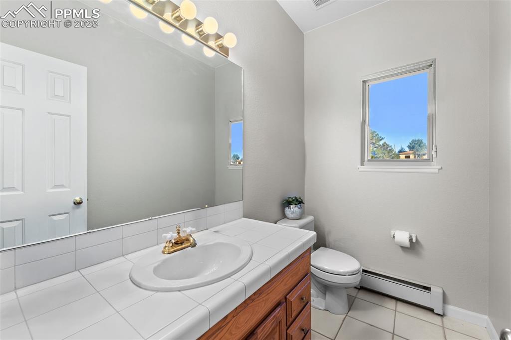Image 18 of 47: Main level powder room.