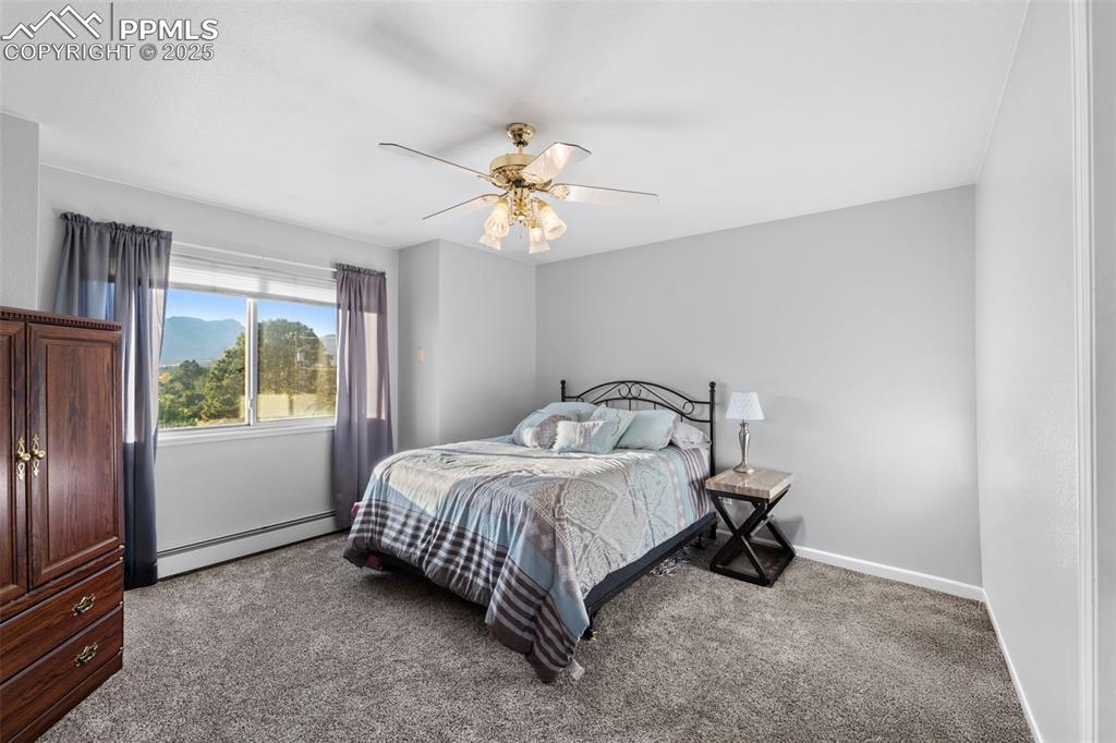Image 33 of 47: The second of four upper-level bedrooms. 