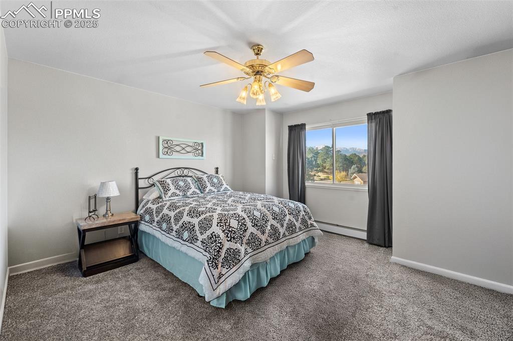 Image 35 of 47: The third of four upper-level bedrooms. 