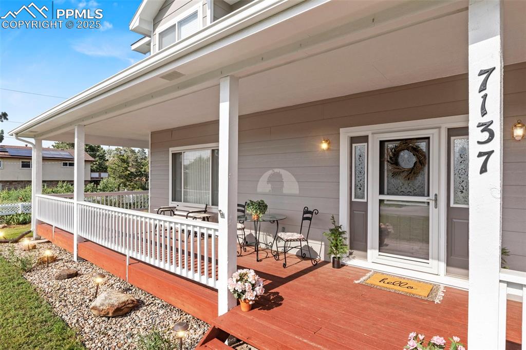 Image 4 of 47: Relaxing front porch.