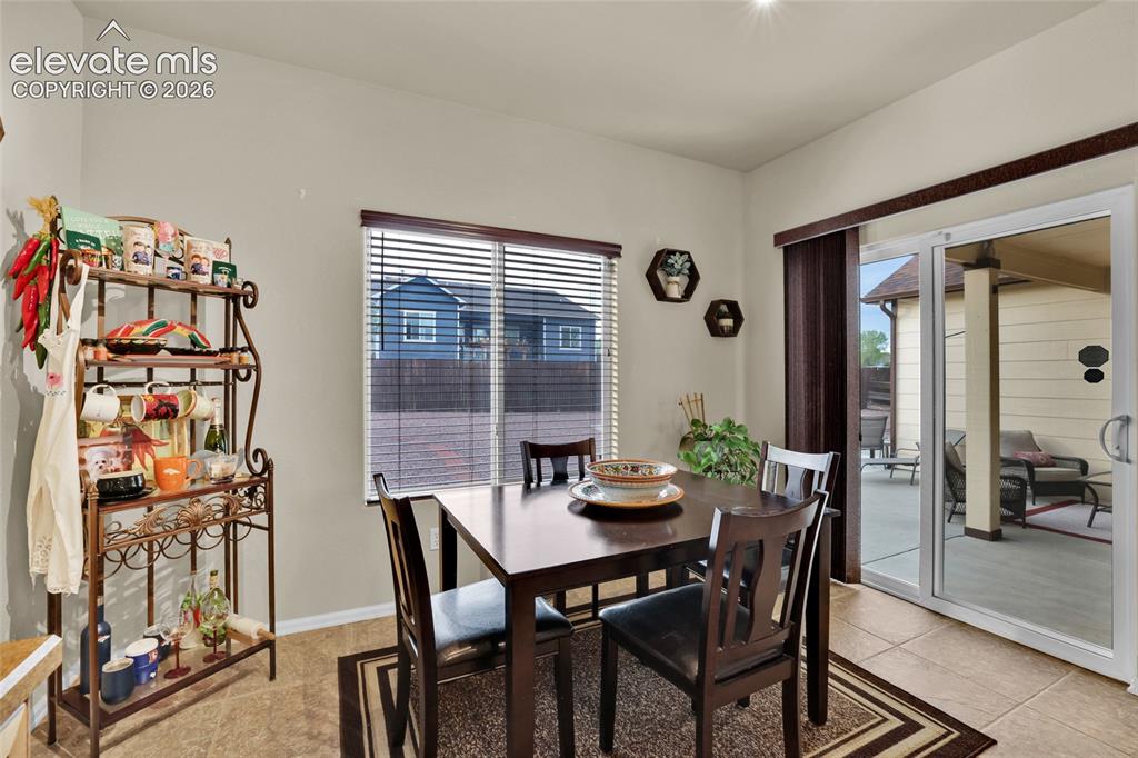 Image 15 of 50: Patio access from dining nook