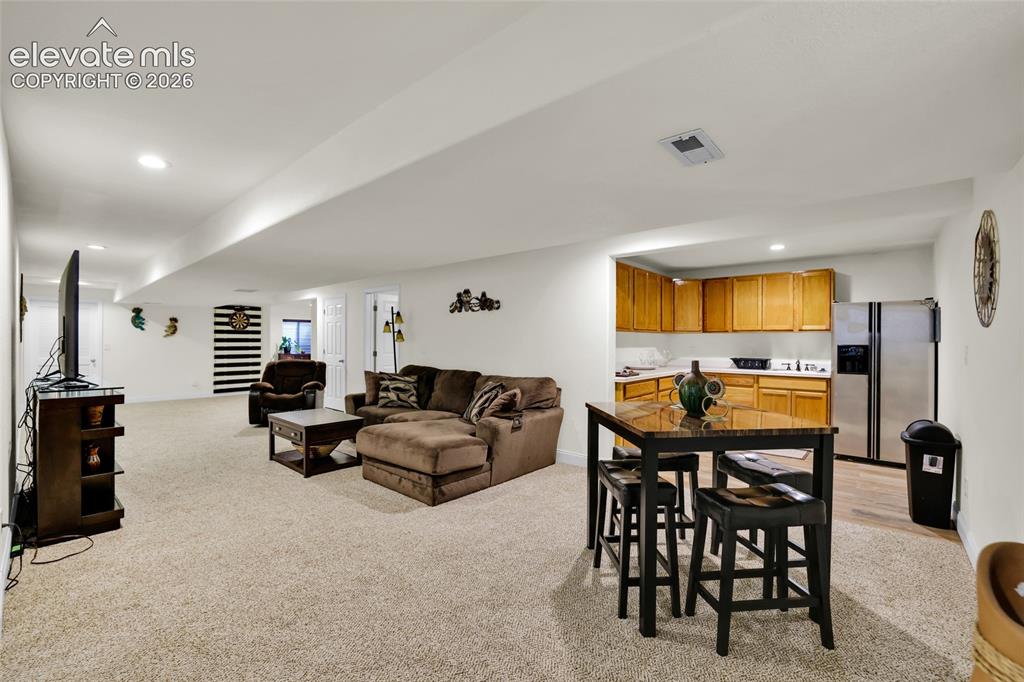 Image 25 of 50: Family room w kitchenette