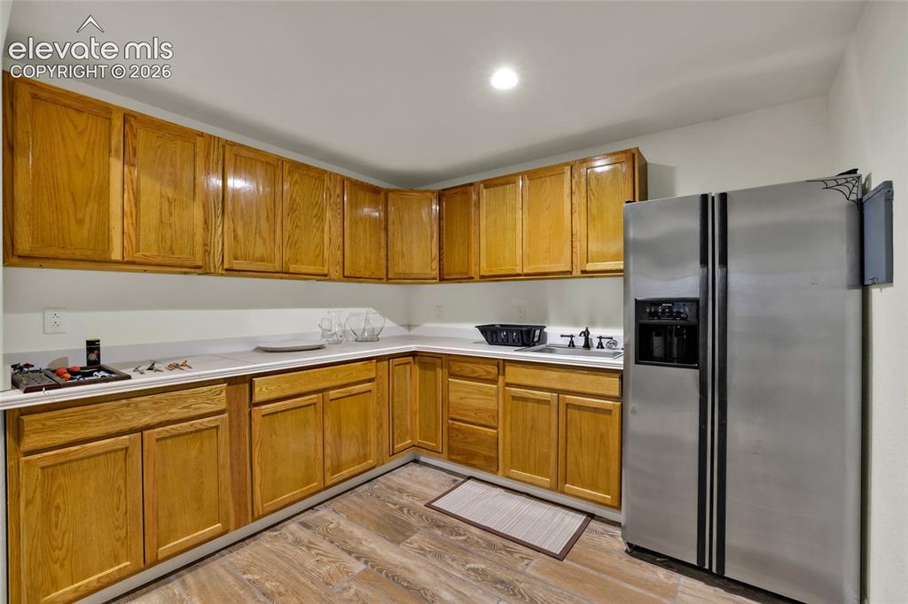Image 26 of 50: Kitchenette in basement