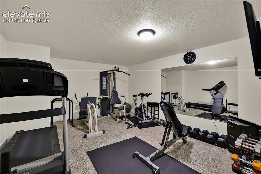 Image 29 of 50: Most gym equipment will stay if buyer wants it
