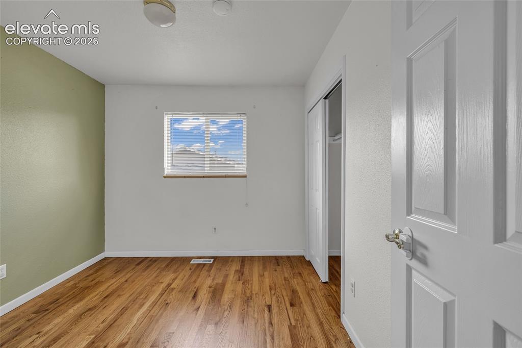 Image 13 of 25: Hardwood-style flooring throughout