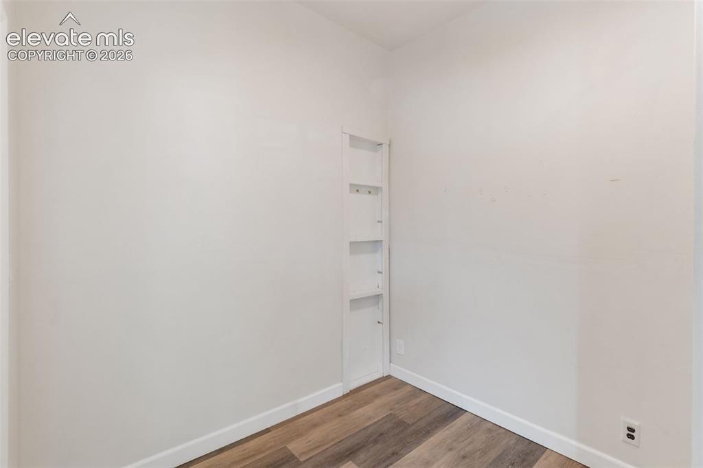 Image 30 of 38: Room off the entry perfect for an at home office space or large mud room!