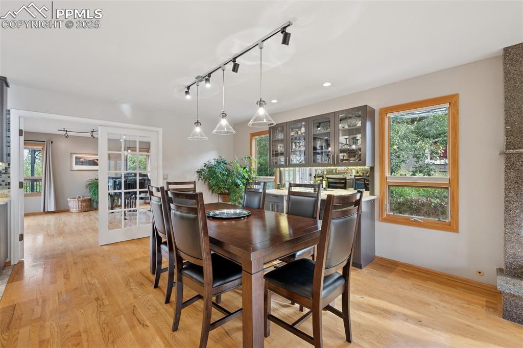Image 12 of 50: Dining Area View Towards the Sunroom