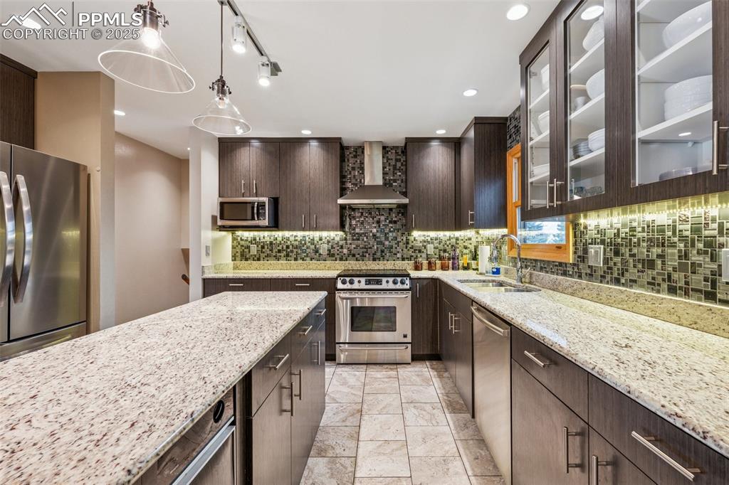 Image 15 of 50: View Of Kitchen Towards The Prep Bar Open To The Living Room