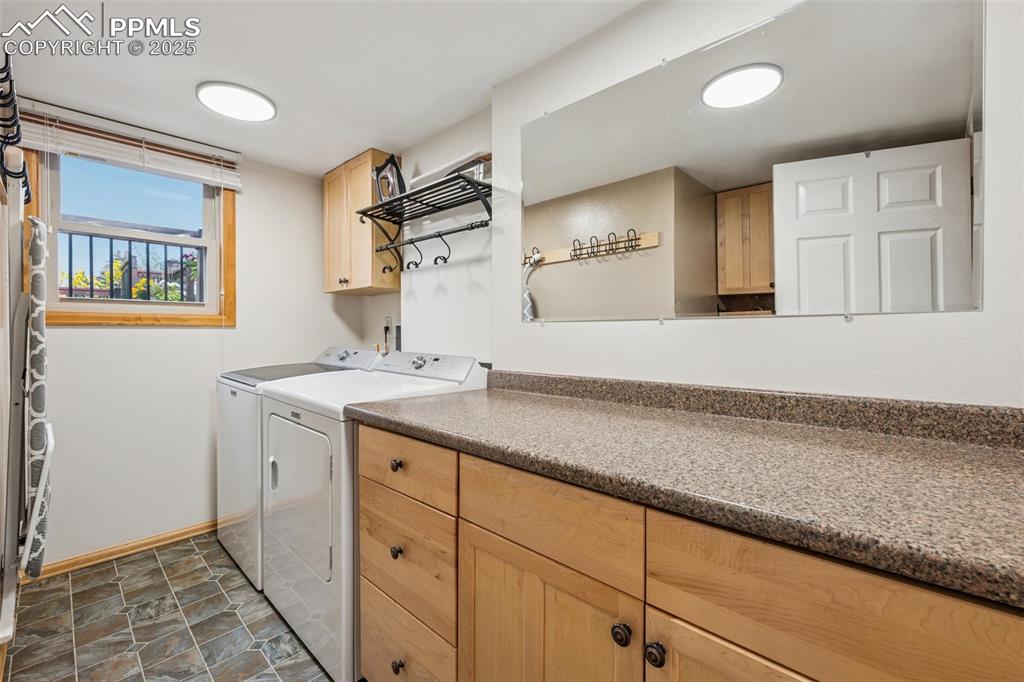Image 27 of 50: Lower Level Laundry Room with Sink and Window