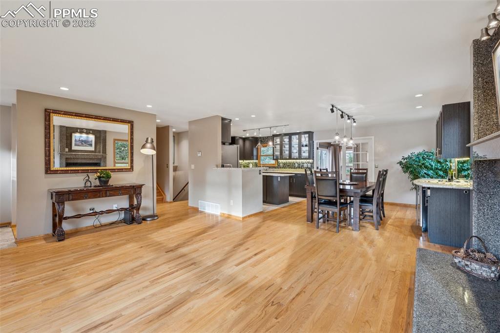 Image 3 of 50: View towards Kitchen and Dining Areas With French Doors To Sunroom