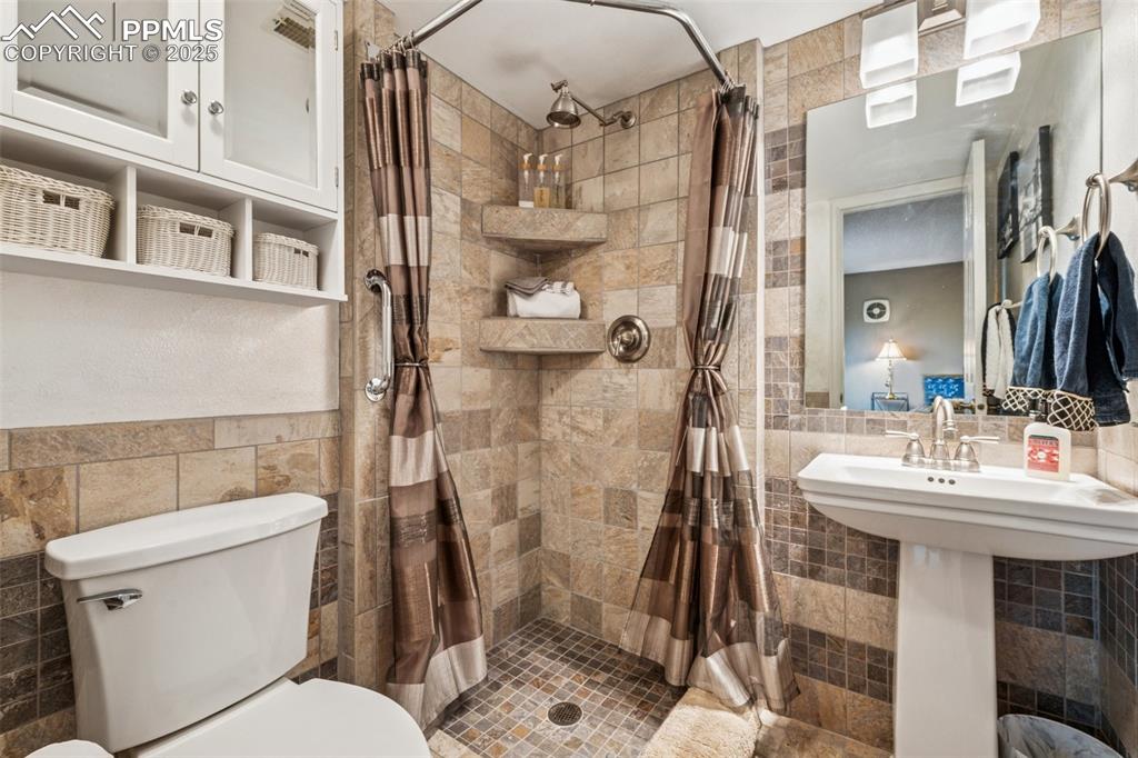 Image 30 of 50: Lower Level 3/4 Bathroom