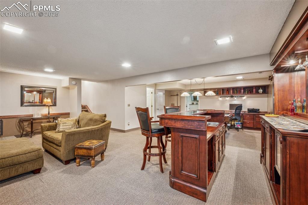 Image 33 of 50: Basement area with Dry Bar