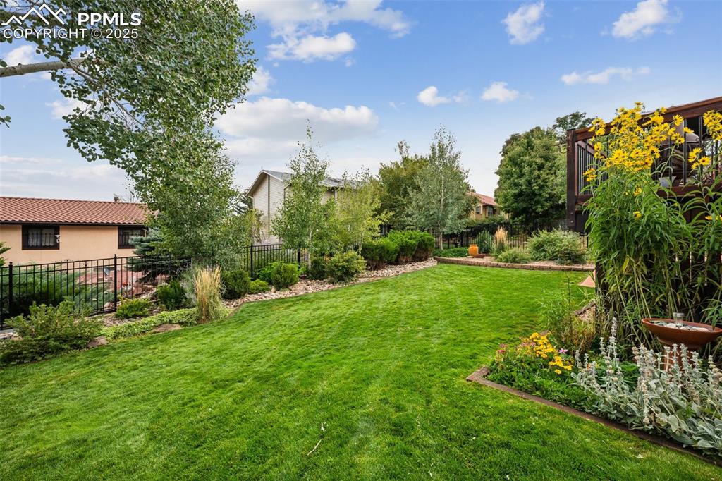 Image 44 of 50: Fully Landscaped yard with automatic sprinklers and drop irrigation.