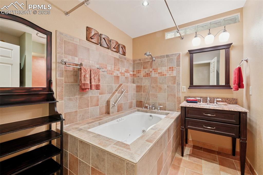 Image 6 of 50: Upper Level Full Bathroom