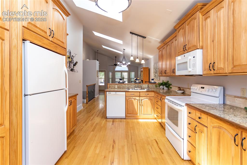 Image 13 of 48: Beautiful maple cabinetry extends to the ceiling, offering
remarkable stor