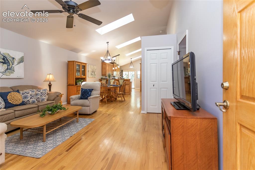 Image 3 of 48: Vaulted ceilings with skylights enhance this living area