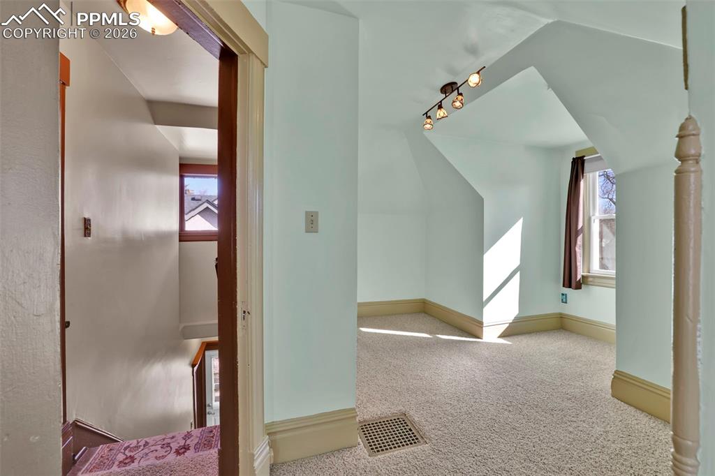 Image 33 of 48: stairs and secondary upstairs bedroom