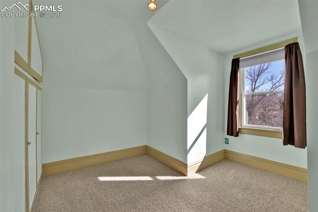 Image 34 of 48: secondary upstairs bedroom