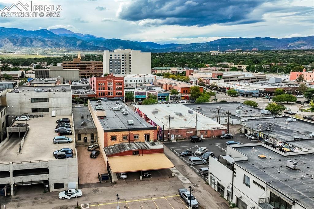 Image 39 of 43: Rear of building showing parking area.