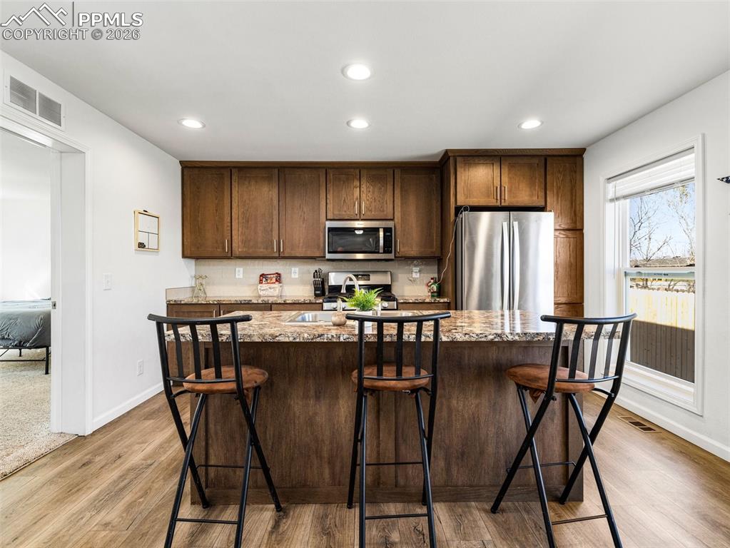 Image 11 of 25: Beautiful kitichen with stainless appliances and a pantry