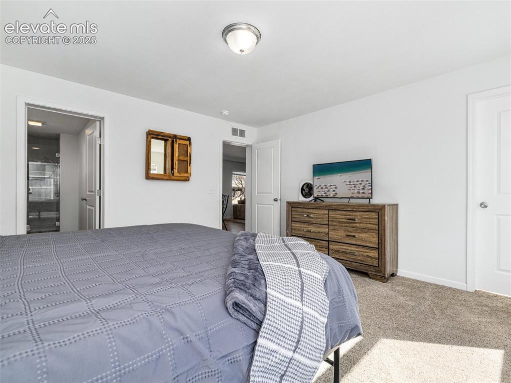 Image 11 of 27: Large primary bedroom with walk in closet