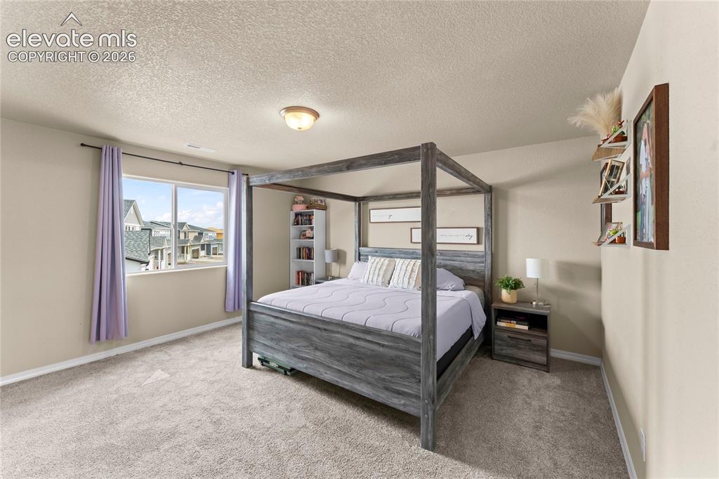 Image 18 of 26: Master Bedroom