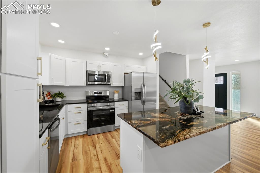 Image 10 of 41: Granite Kitchen Island with overhang for stools