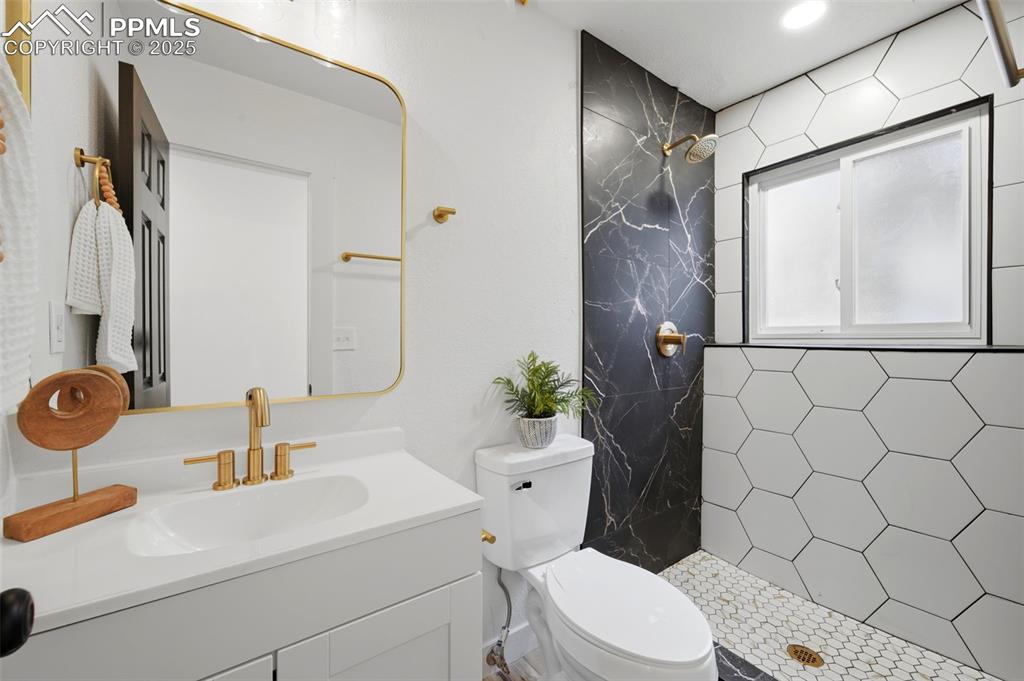 Image 28 of 41: New tile standup shower in basement